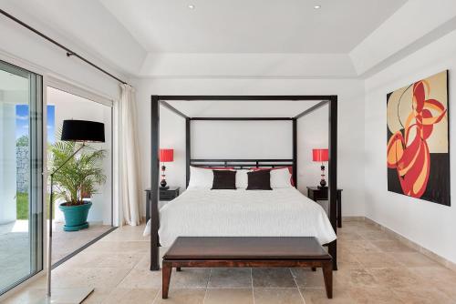 Ένα ή περισσότερα κρεβάτια σε δωμάτιο στο Villa Ambiance