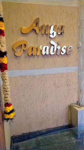 a sign for the zig zag parades on a wall at Anya Paradise in Ooty