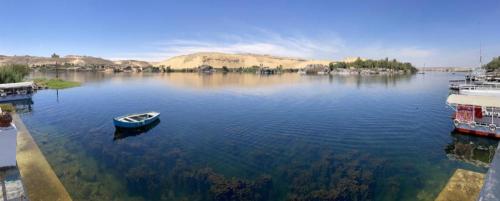 a small boat sitting in the middle of a lake at Nile View Guest House in Aswan