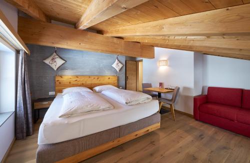 Postel nebo postele na pokoji v ubytování Aparthotel Grischuna