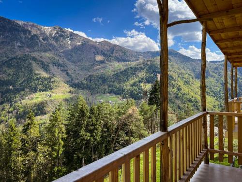 a view from a cabin balcony with a view of mountains at Hotel Khulo lnn in Khulo