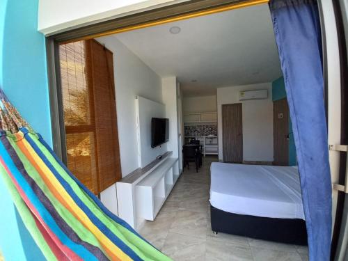 Tempat tidur dalam kamar di Avadia del Mar