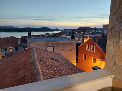 a view of a city from the roof of a building at Beetlejuice Apartments in Šibenik