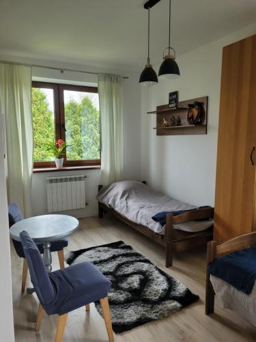 Postel nebo postele na pokoji v ubytování Agroturystyka z Fantazją