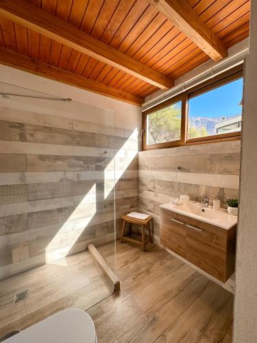 a bathroom with a sink and a window at Aldea del Valle - Elqui Villas, Pisco Elqui in Pisco Elqui