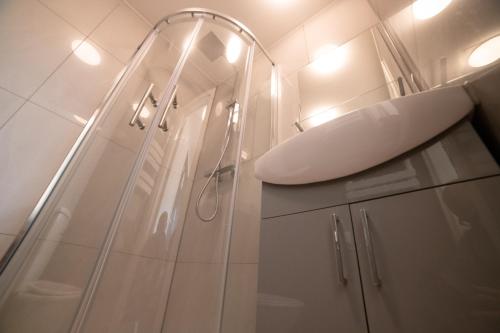 a bathroom with a shower and a sink at Stunning 1-Bed Apartment in London in London