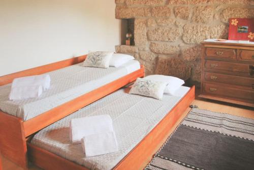 Un pat sau paturi într-o cameră la Retiro de Várzeas . Casa de Turismo Rural