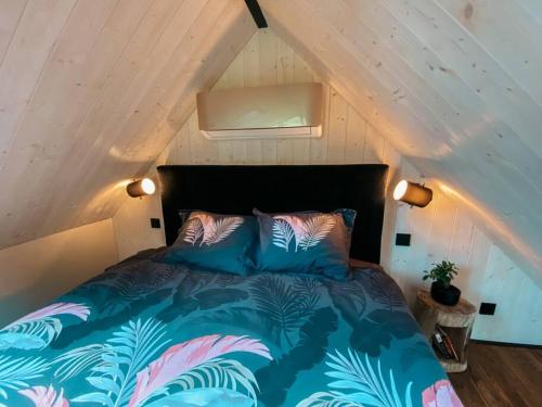 a bedroom with a bed in a attic at Private Stay Zen House to unplug and recharge in Tuimõisa
