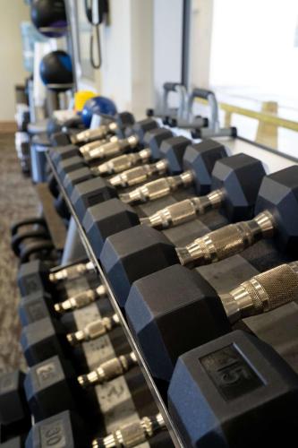 a row of remote controls lined up in a room at Waikiki Malia in Honolulu