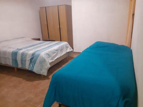 a bedroom with a bed and a dresser at Mi gran sueño in San Rafael
