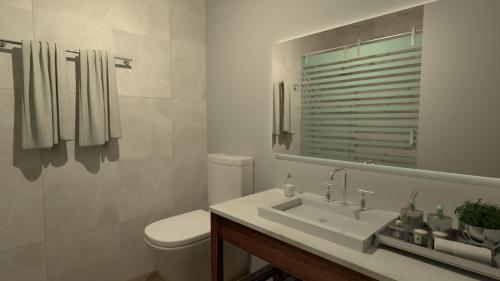 洛斯莫奇斯的住宿－Country Place Hotel，一间带水槽、卫生间和镜子的浴室