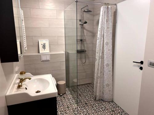 a bathroom with a sink and a shower at Lovely Apartment with 2-bedrooms and living room for 4 guests, max 6 - Seaside Neighborhood in Reykjavík