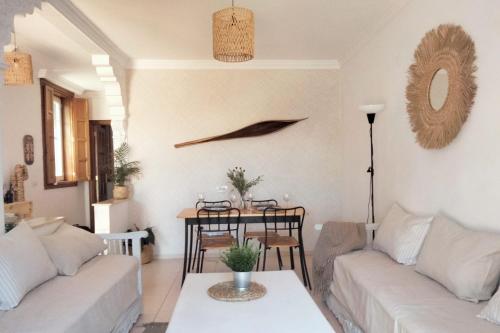 a living room with a couch and a table at La casita in Arona