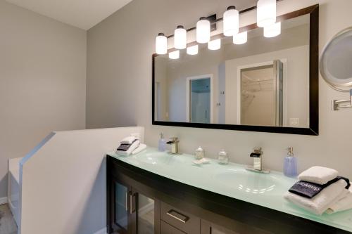 a bathroom with a sink and a mirror at Renovated Sunny Port St Lucie Home with Outdoor Pool in Port Saint Lucie