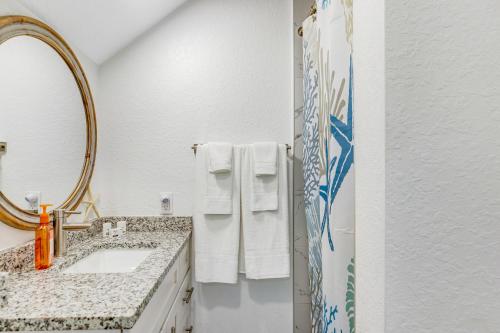 a white bathroom with a sink and a mirror at Keys to Happiness in Marathon