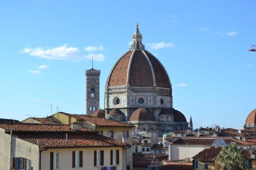 a view of a city with a cathedral and buildings at Palazzo Graziani in Florence