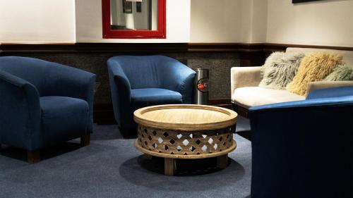 Coin salon dans l'établissement Hotel Indigo Guadalajara Expo by IHG