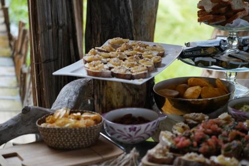 a buffet of pastries and other food on a table at Bethel Lozana Guatape in Guatapé