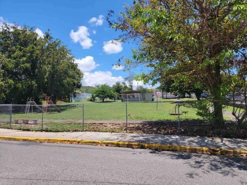 a view of a park with a playground at Mi casa El Rincón in Juana Diaz