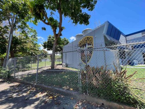 a chain link fence in front of a baseball field at Mi casa El Rincón in Juana Diaz