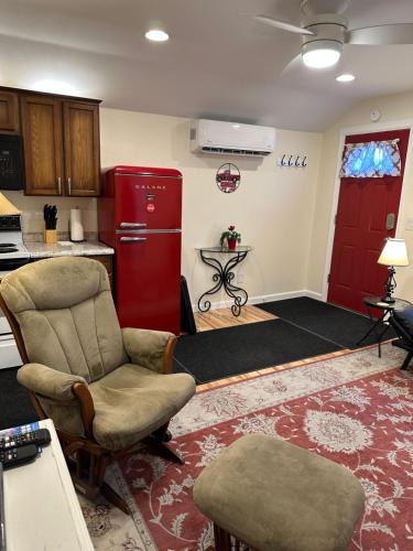 a living room with a red refrigerator and chairs at NEW Private House B with Carports EV Plugin L2 in Twin Falls