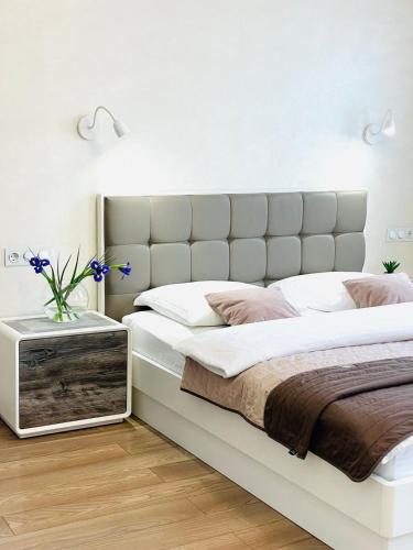 En eller flere senge i et værelse på Apartment ЖД вокзал, Центр