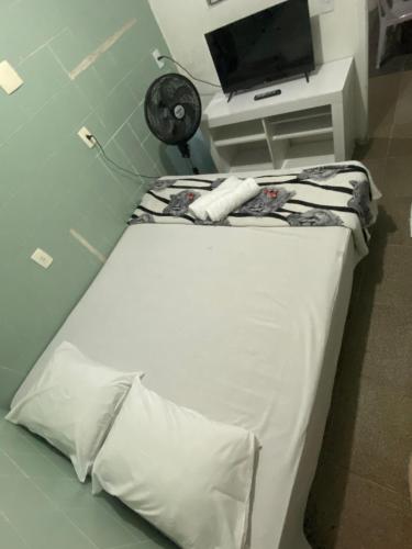 En eller flere senge i et værelse på Pousada Kavili 150m da Praia