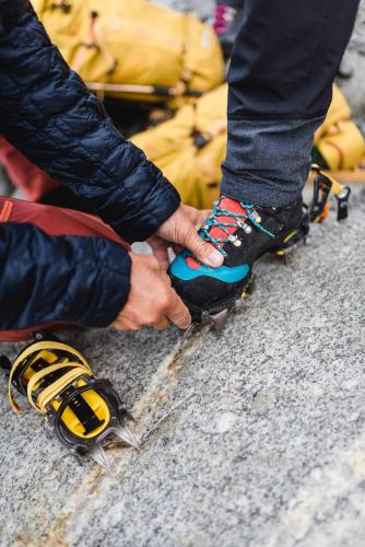 a person is tying his shoes on a skateboard at monas home mayrhofen in Mayrhofen