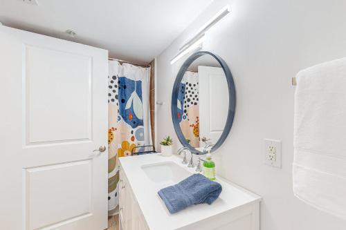 a bathroom with a white sink and a mirror at Club Wyndham 521 in Myrtle Beach