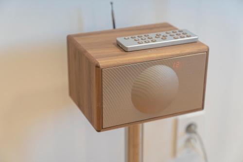 a radio with a remote control on top of it at Aank Hotel Cheonan Station 1st in Cheonan