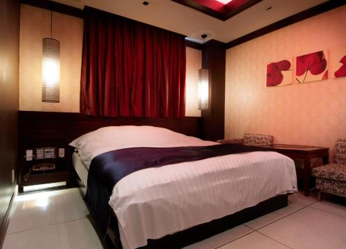 Cama ou camas em um quarto em HOTEL ZERO