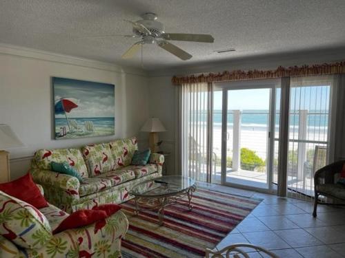 a living room with a couch and a view of the ocean at South Shores I 3 Condo in Myrtle Beach