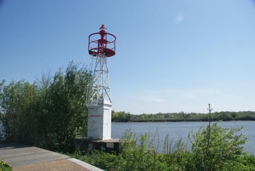 a lighthouse on the side of a body of water at La Vigie in Couëron