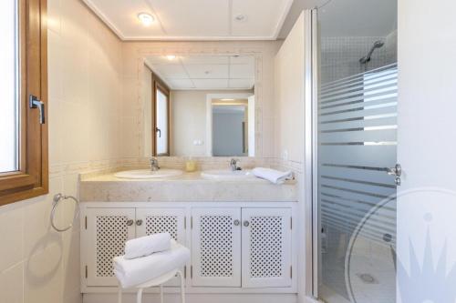a bathroom with a sink and a mirror and a shower at Buena Vista G5 in Atamaría