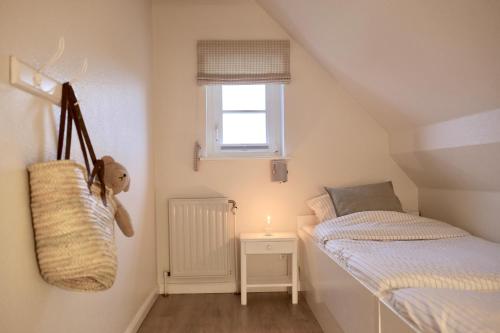 Postel nebo postele na pokoji v ubytování Ferienwohnung "Habel" an der Nordsee