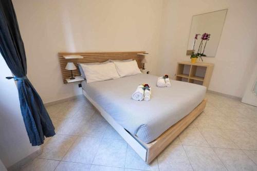 Cama o camas de una habitación en Alloggio in palazzina stile Liberty Fronte Mare