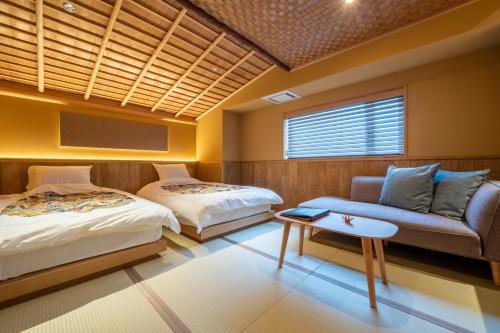 Ένα ή περισσότερα κρεβάτια σε δωμάτιο στο Nishiyama Ryokan - Established in 1953