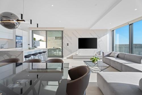 a living room with a couch and a table at Seaview villa with Wellness, Dreams Of Dalmatia II in Baška Voda