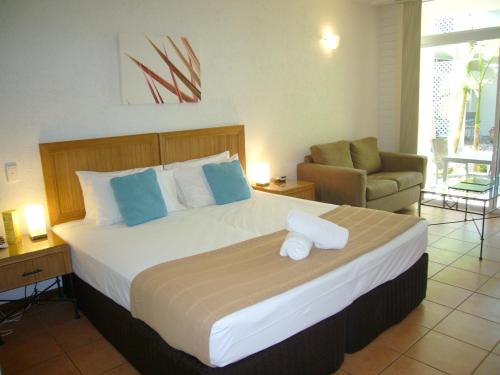Säng eller sängar i ett rum på Port Douglas Retreat