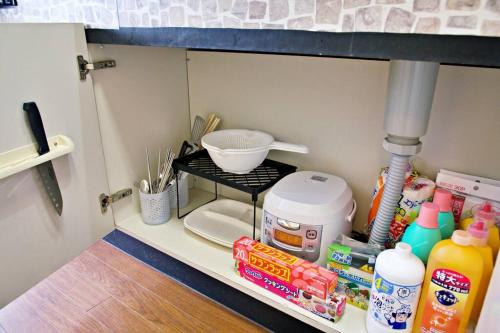 Una cocina o cocineta en ピースリー安里201