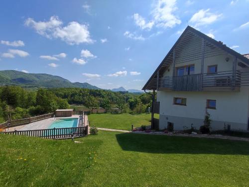 a house with a swimming pool in a yard at Relax Guest Hause Marjanca in Rogaška Slatina