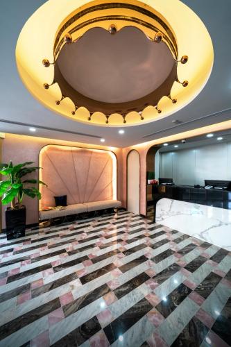 a lobby of a hotel with a large ceiling at Hotel 81 Premier Princess in Singapore