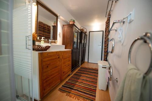 a bathroom with a sink and a vanity and a mirror at Architect Art Studio in Athens