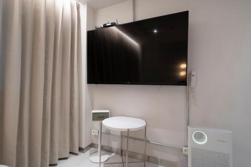 TV a/nebo společenská místnost v ubytování Aank Hotel Osan