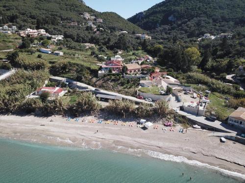 an aerial view of a beach with a group of people at NIKI in Paramonas