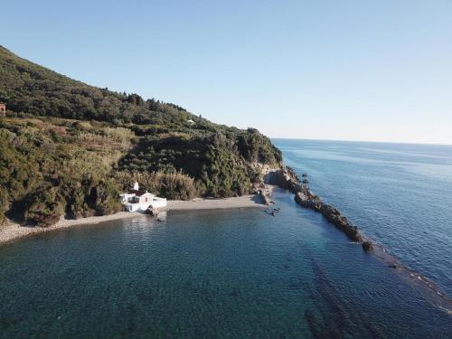 an aerial view of a small island in the ocean at Ilias in Paramonas