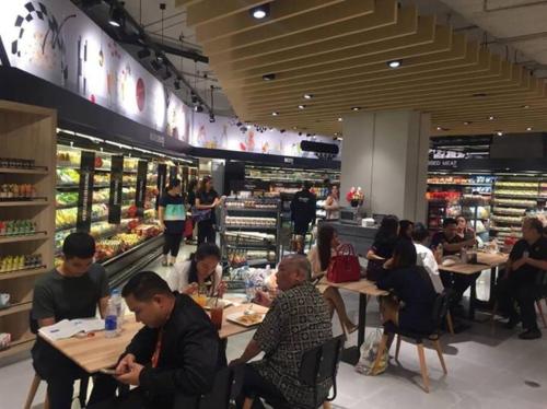 a group of people sitting at tables in a store at HIGH RISE LUXURY CONDO 1BED ROOF TOP POOL 2 MinMRT in Bangkok