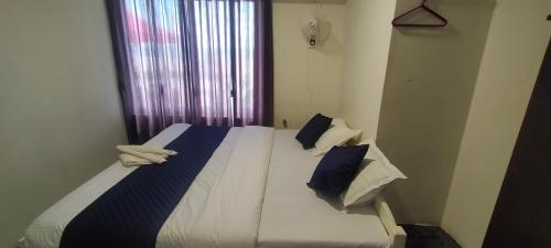 Ένα ή περισσότερα κρεβάτια σε δωμάτιο στο Alivious Beach Homestay