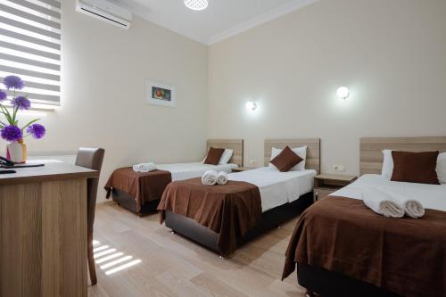Katil atau katil-katil dalam bilik di Daisi Sunset Hotel