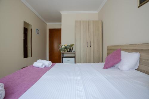 Katil atau katil-katil dalam bilik di Daisi Sunset Hotel
